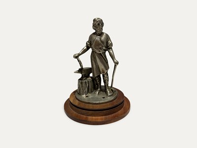 Lot An early Vulcan " Blacksmith " Radiator Mascot