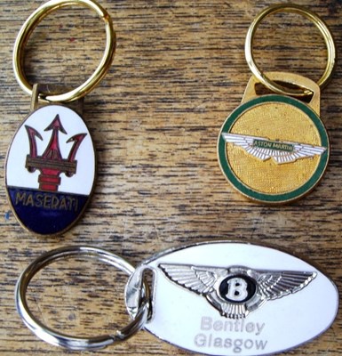 Lot 46 - Three enamel keyrings
